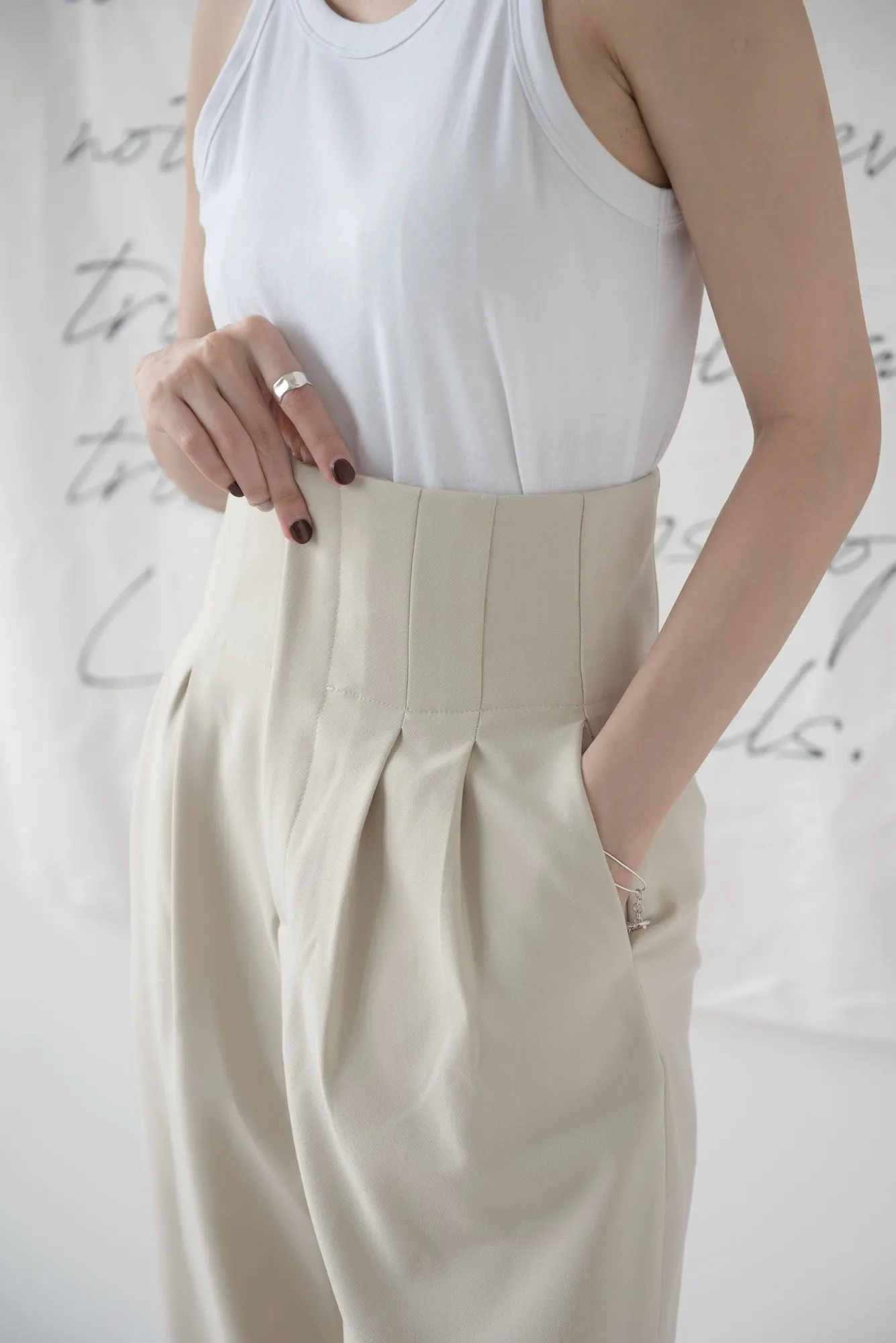 High-waisted wide-legged trousers